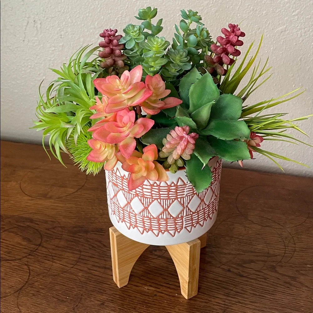 Contemporary Faux Succulent Mix in a Burnt Orange and White Ceramic Footed Vase